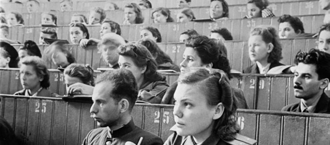 people sitting in a communist lecture